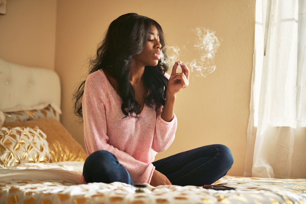 woman_bed_cannabis_joint.jpg