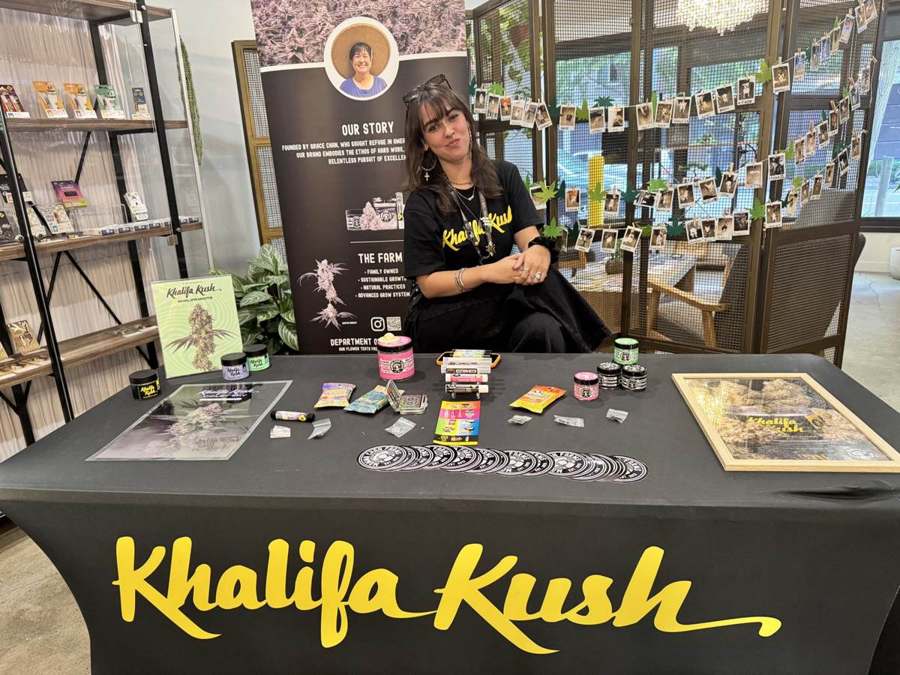A featured vendor display with banner and shelves set up inside the Origins West Seattle store
